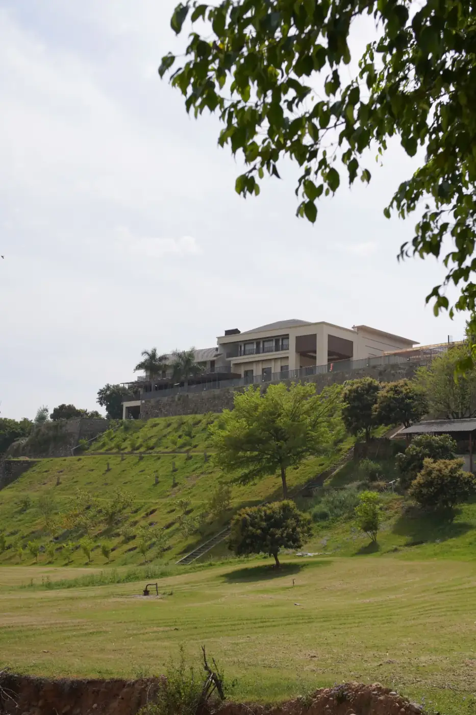 Spring Hill Resort exterior above the green lawns